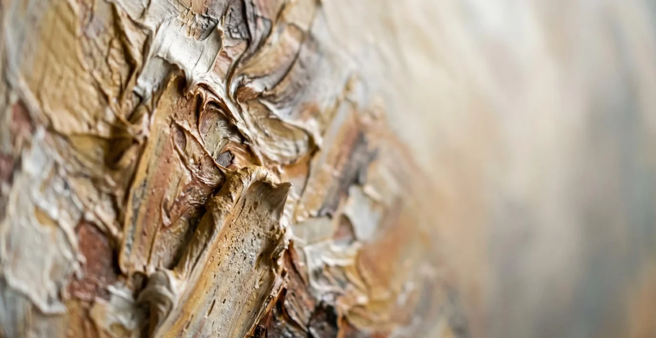 Textured abstract oil painting surface with cold wax medium showing sculptural impasto layers and translucent veils of color